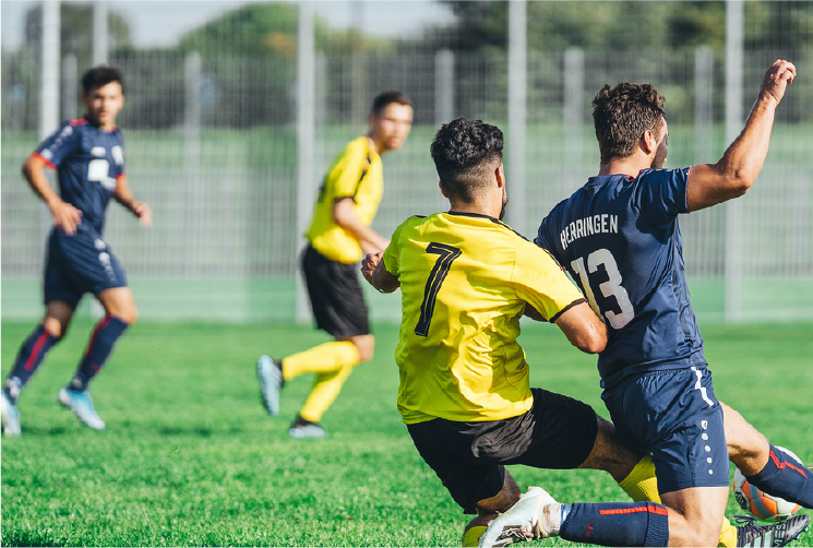 Youths playing soccer